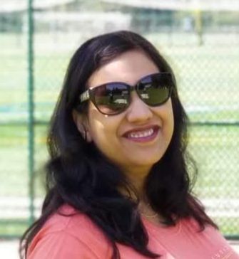 Portrait of Monika Jain, Founder and CEO of Charter My Bus