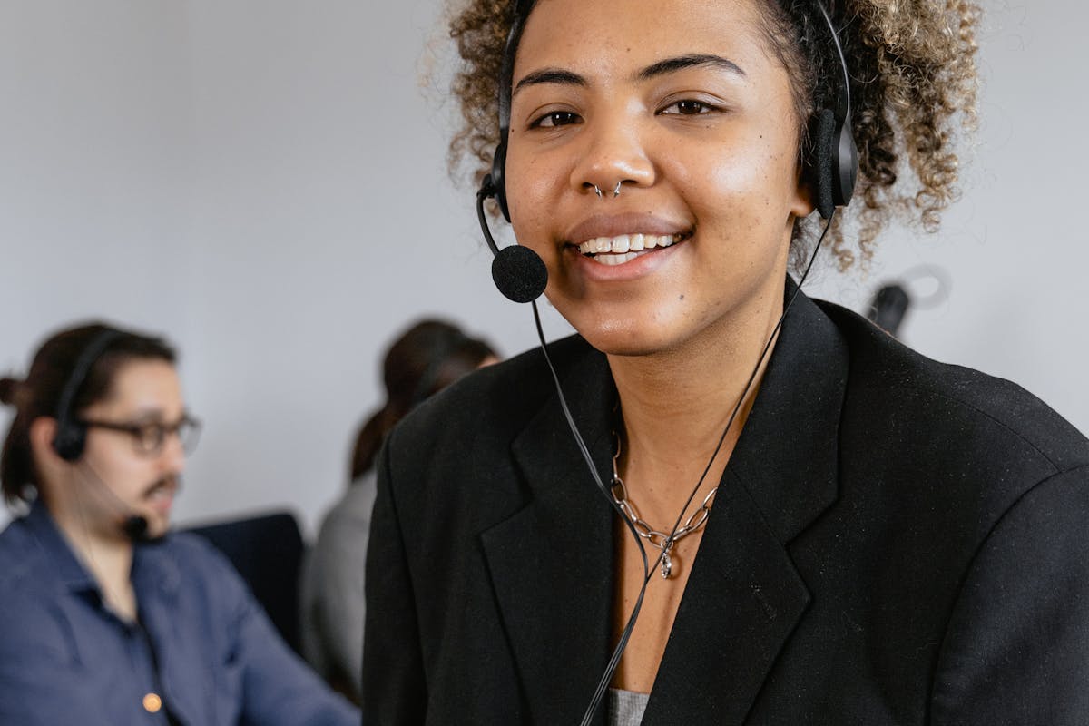 Support representative on headset ready for fast customer follow-up